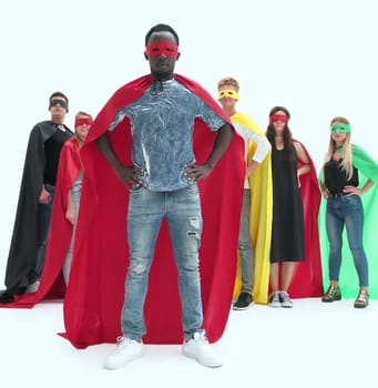 in full growth. stylish guy in a superhero Cape standing in front of his team