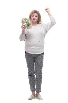 in full growth. happy adult woman with banknotes. isolated on a white background.
