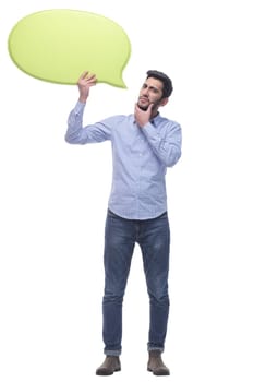 in full growth. smiling young man with a speech bubble . isolated on a white background.