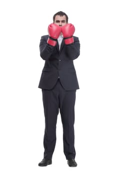 Business man ready to fight with boxing gloves looking at camera isolated over white background