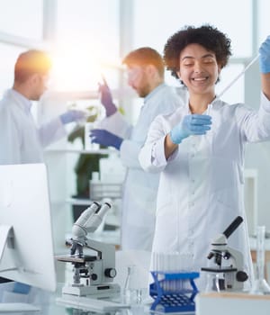 Team of Scientists Working Using Microscope, Analysing Microbiology Samples