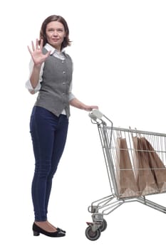 casual mature woman with shopping cart . isolated on a white background.
