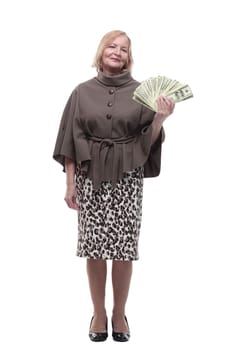 in full growth. happy mature woman with dollar bills . isolated on a white background.