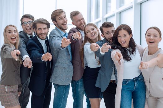 group of successful young people pointing at you. concept of choice