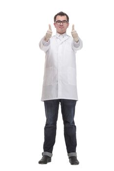 Man with serious face in laboratory coat putting on gloves.. Medicine and professional skills concept. Physician isolated on white background.