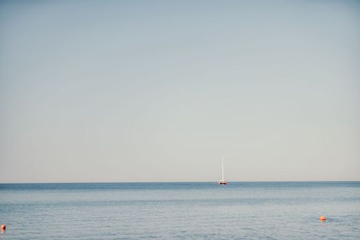 Aerial boat race. Luxury cruise trip. View from above of white boat on deep blue water. Aerial view of rich yacht sailing sea. Motor boat racing wave. Summer journey on luxury ship