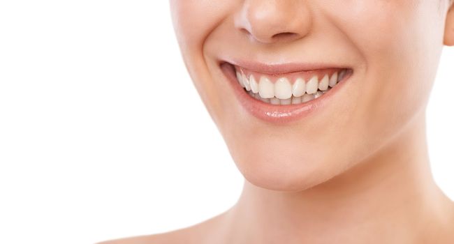 Dental hygiene. Cropped image of a woman smiling broadly - copyspace