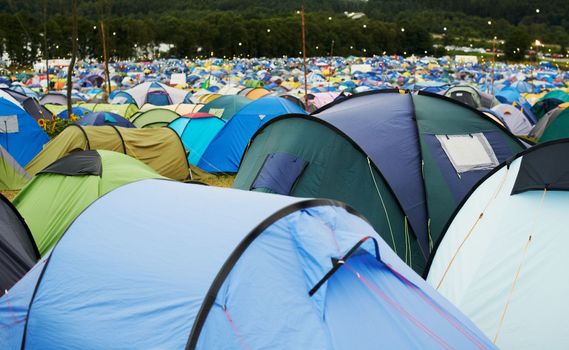 Chock full of tents. Landscape shot of tents on a field at an outdoor festival