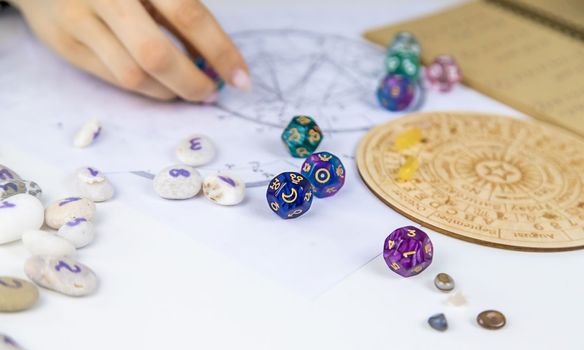 Woman numerologist astrologer counts numbers. Selective focus. People.