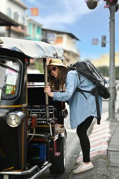 Caucasian female tourist with backpack on holiday vacation trip in Thailand. Travel Lifestyle vacations concept.