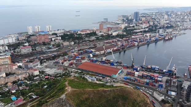 Top view. Vladivostok Commercial Sea Port. Industrial port with containers in Vladivostok