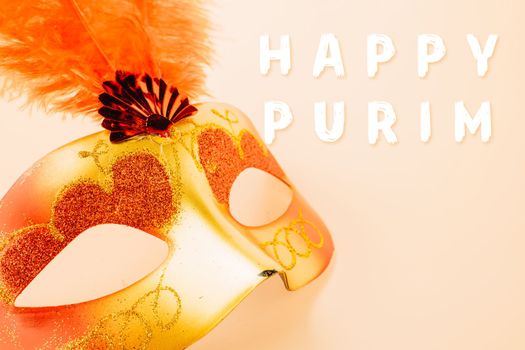 Happy Purim carnival decoration. Top view venetian ball mask with red feather on pastel background, Jewish Purim or Mardi Gras in Hebrew, holiday background banner design, Masquerade party