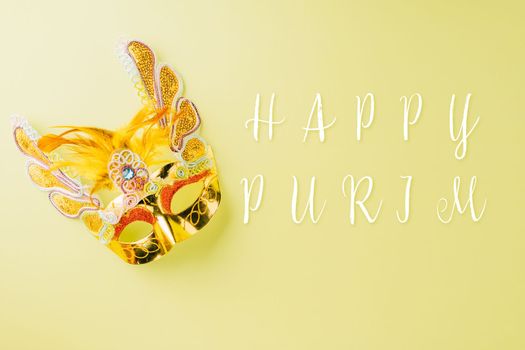 Happy Purim carnival accessories. Carnival mask for Mardi Gras celebration isolated on pastel green background, jewish holiday, Purim in Hebrew holiday carnival ball, Venetian mask