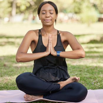 Yoga, black woman meditation in park and mindfulness, zen outdoor in nature. Peace, spiritual energy and chakra balance with self care and stress relief. Fitness, wellness with body care and namaste.