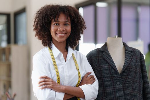 Portrait of young african american woman fashion designer stylish working at fashion studio