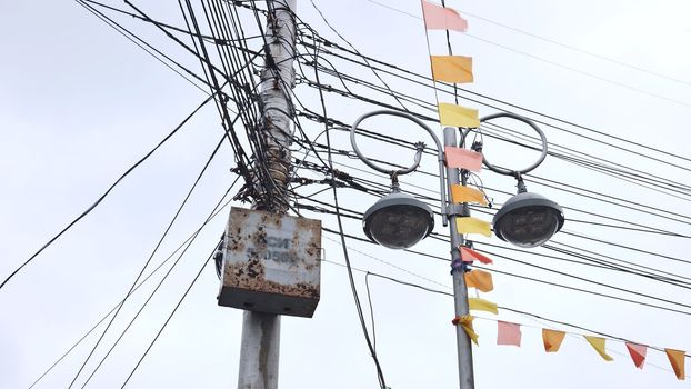 Power lines in the city on a cloudy day