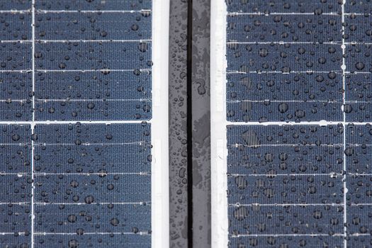 Solar panel in winter. Solar panels are covered with snow on the roof of the building, the use of modules in difficult weather conditions. Electricity production in winter, with copy space.