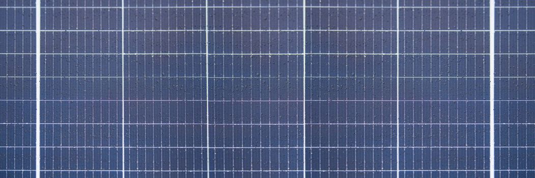 Solar panel texture with raindrops, waterproof solar panel modules, top view, as background or texture.