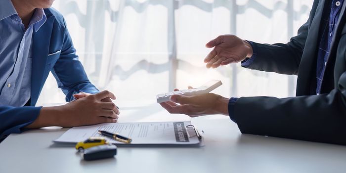 Close up Agency explain agreement contract for loan credit financial, lease and rental concept.