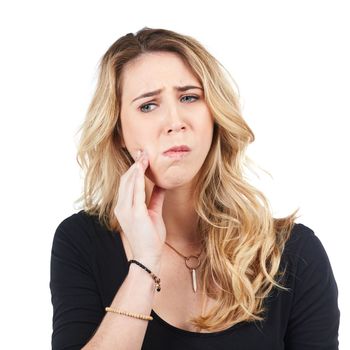 Woman, toothache and angry face for dental care, tooth decay or healthcare wellness isolated in white background. Young female, dentist and female emergency or mouth problem frustrated in studio.