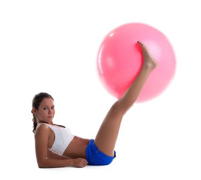 woman lay and take fitness ball with legs isolated