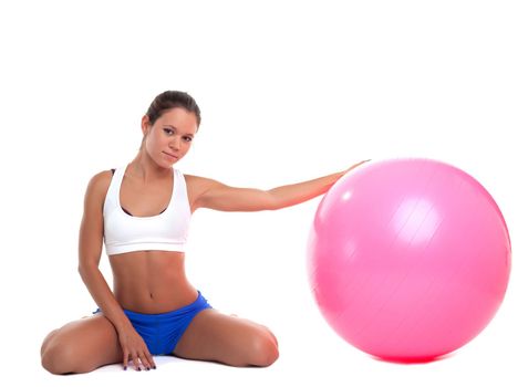 young beauty woman relax with fitness ball isolated