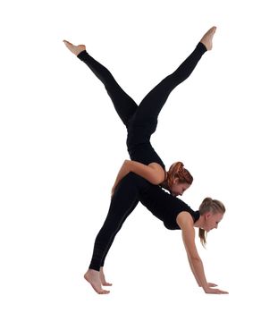 two woman gymnast in black show acrobatic exercise isolated