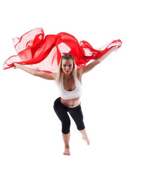 Young beauty woman in yoga uttkatasana and yellow flying cloth isolated