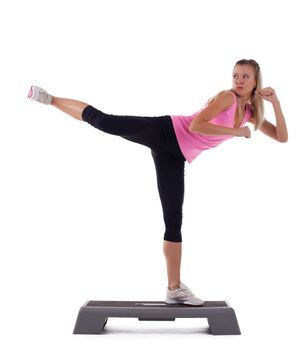 young blond woman stand on step and fight isolated