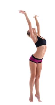 young woman woth perfect body stand in fitness costume isolated