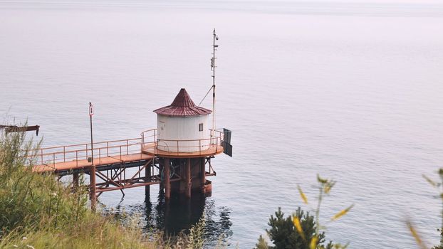 View of lake Baikal with a lighthouse in the foreground on a summer day