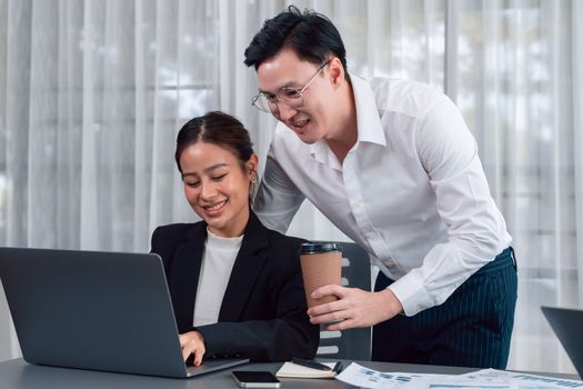 Mentor, manager with coffee advice younger colleagues in workplace. Couple businesspeople discussing financial strategy, working together for harmony and strong teamwork in office concept