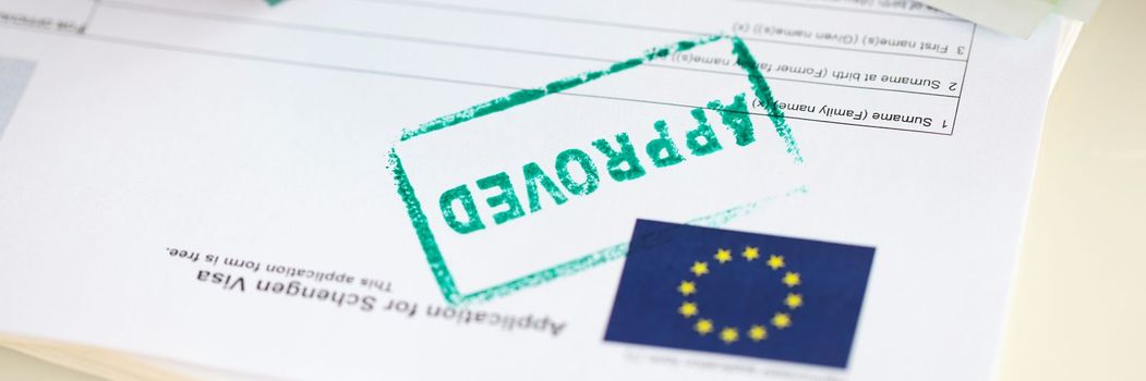 Approved EU visa application and cash euro banknotes. Obtaining visa to Europe and moving to European country
