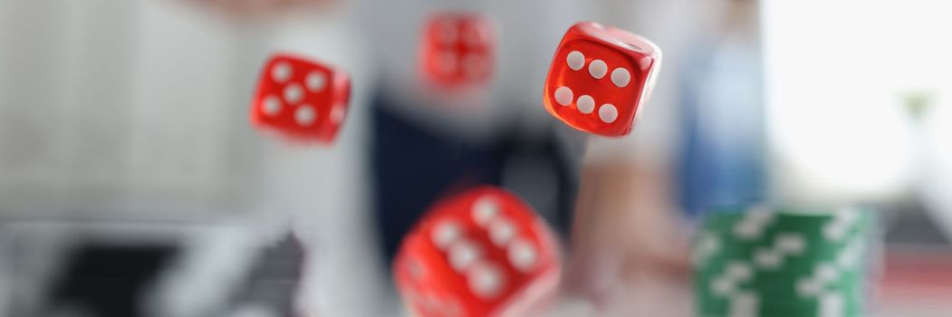 Closeup of man throwing dice. Gambling concept