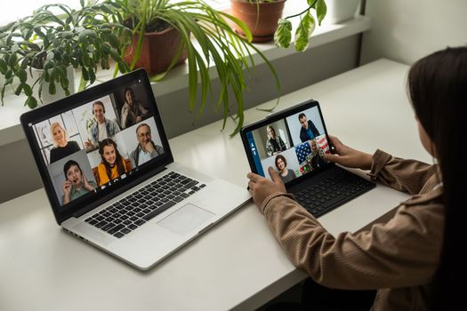 Online conference of colleagues through a laptop. Video call for training. Educational webinar chat between different people. Team meeting.