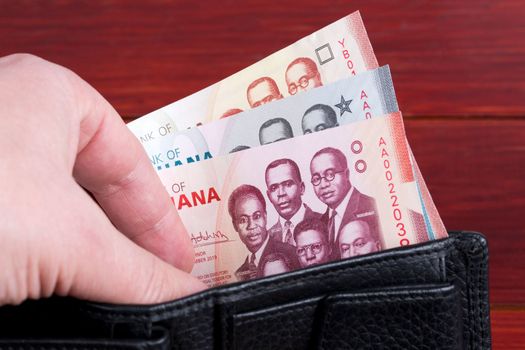 Ghanaian money - cedi in the black wallet	
