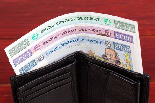 Djiboutian money - franc in the black wallet