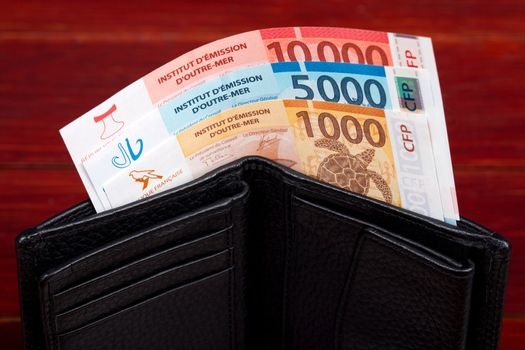 CFP money - francs in the black wallet