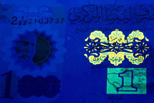 Libyan dinar in UV rays