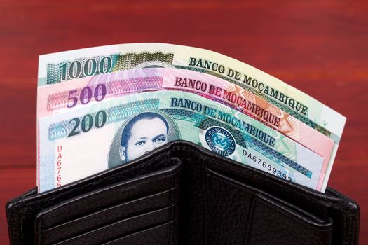 Mozambican money - metical in the black wallet