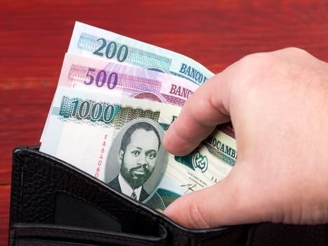 Mozambican money - metical in the black wallet