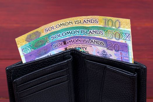 Solomon Islands money - dollar in the black wallet