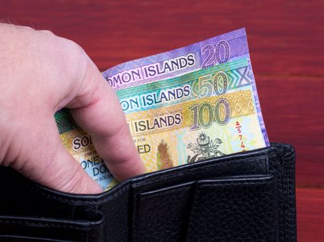 Solomon Islands money - dollar in the black wallet