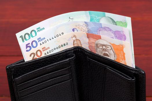 Colombian money - peso in the black wallet