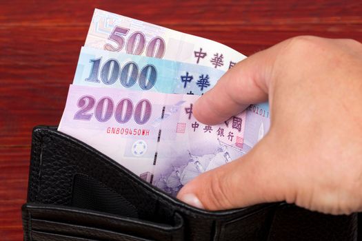 New Taiwan money - dollar in the black wallet