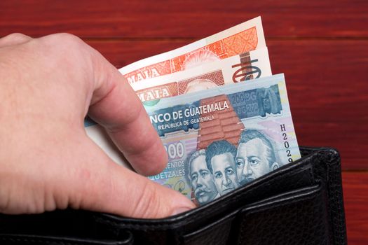 Guatemalan money - quetzal in the black wallet
