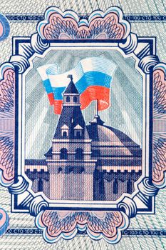 Russian flag over stylized Kremlin from money