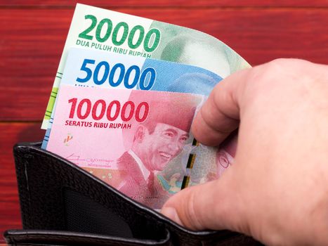 Indonesian money - rupiah in the black wallet