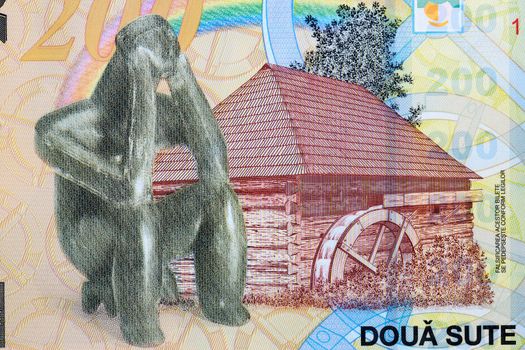 A watermill and The Hamangia Thinker from Romanian money - Leu