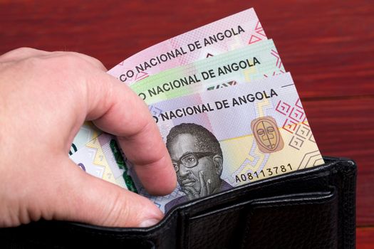 Angolan money - Kwanza in the black wallet